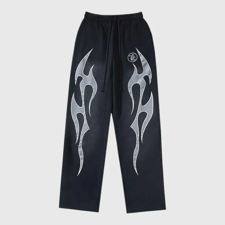 Hellstar Flame sweatpants in black featuring a white fire graphic print on both legs and an elastic drawstring waist.