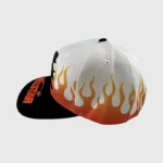 Hellstar Flame Vintage Snapback Hat featuring a white crown with orange flames and a black embroidered brim.