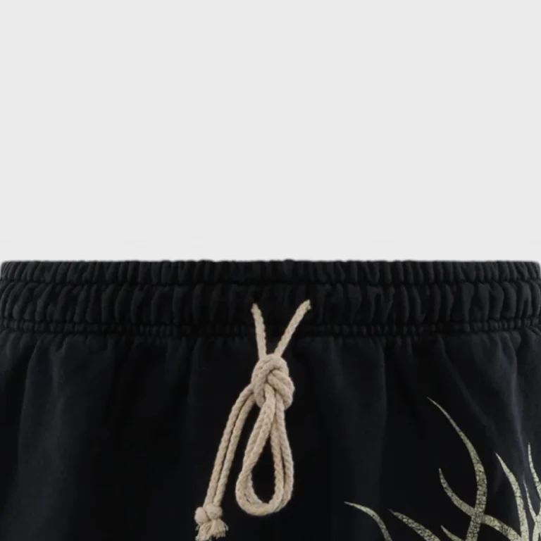 Front view of the black Hellstar Flame Yang shorts showing the elastic waistband and detailed white drawstring tie