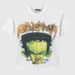 Hellstar Franken Kid T-Shirt in white featuring a green Frankenstein monster graphic and signature orange logo text.