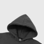 Close-up view of the dark grey Hellstar Future Flame hoodie featuring branded label detailing on the neck.