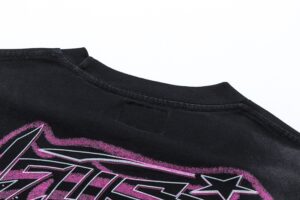 Close-up view of the black Hellstar Future T-Shirt featuring a vibrant pink graphic and durable crew neck design.