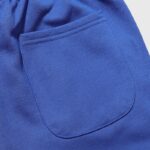 Close-up view of the back pocket detail on the vibrant blue Hellstar tracksuit, showcasing premium cotton fabric.
