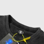 Closeup of Hellstar Goggles black T-shirt ribbed crewneck, size tag and yellow hangtag cord on vintage cotton