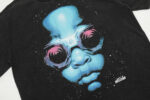 Black Hellstar Goggles T-shirt featuring a futuristic graphic of a face with oversized goggles and blue tones.