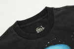 Close-up view of the interior neck label and premium cotton fabric of the black Hellstar Goggles T-Shirt design.