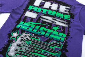 Purple Hellstar Goggles T-shirt featuring a neon green futuristic face graphic with goggles and sci-fi text branding.
