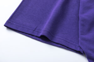 Close-up view of the premium purple cotton fabric used on the Hellstar Goggles T-Shirt streetwear garment.
