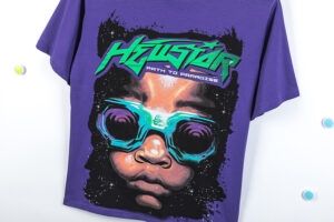 Front view of the purple Hellstar Goggles T-shirt featuring a neon graphic print of a face with futuristic goggles.