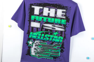Purple Hellstar Goggles T-shirt featuring a bold futuristic graphic print with neon lettering and sci-fi aesthetic.