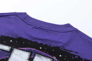 Close-up view of the purple fabric and neckline area of the Hellstar Goggles T-shirt, featuring premium cotton.