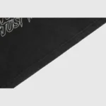 Close-up view of the graphic screen print detail on the black Hellstar Gradient Stars Hoodie streetwear apparel.