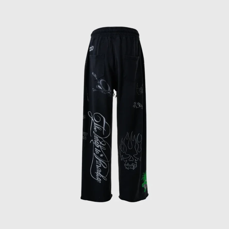 Black Hellstar Graffiti sweatpants featuring a hidden pocket design and bold urban graphic screen prints on legs.