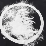 Close-up of the Hellstar hoodie featuring a bold white distressed graphic print of a star and flames on a black fabric.