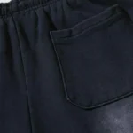 Close-up view of the practical pocket detail on the black Hellstar Graffiti streetwear sweatpants for men and women.
