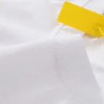 Close-up view of the premium 100% heavyweight cotton fabric and reinforced stitching on a Hellstar Graffiti T-Shirt.