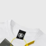 Close-up of the Hellstar Graffiti T-shirt neck label on premium white cotton fabric for an authentic urban look.