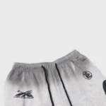Close-up view of the waistband on Hellstar gray graphic print sweatpants featuring black drawstring details.