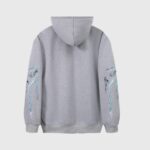 Back view of a grey Hellstar hoodie with unique graphic screen prints on the sleeves and comfortable fleece.