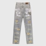 Back view of Hellstar premium vintage washed grey denim jeans with distressed detailing and signature graphic screen print.
