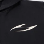 Close-up view of the black Hellstar H logo print hoodie featuring the signature graphic design on the chest fabric.
