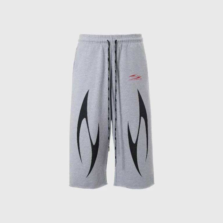 Hellstar H3star 3/4 length grey shorts featuring black tribal graphic prints and an elastic waistband with drawstring.
