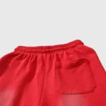Close-up back view of Hellstar Halloween Flame Sweatpants in red cotton featuring a back pocket and elastic waistband.