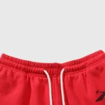 Detailed close-up of the red Hellstar Halloween Flame Sweatpants showcasing the elastic waistband and white drawstring.