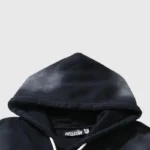 Closeup of Hellstar Halloween skeleton black hoodie showing hood, white drawstring and branded Hellstar label for tracksuit