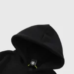 Close-up detail of the hood and interior label on the black Hellstar Halloween Skeleton Print cotton hoodie.