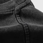 Detailed close-up view of the premium black cotton fabric used in the Hellstar Halloween Skeleton streetwear T-shirt.
