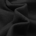 Close-up view of the premium heavyweight black fleece fabric used on the Hellstar Hand Logo hoodie for a soft feel.