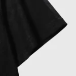 Close up view of the fabric and sleeve detail on the black Hellstar Hand Prayer Print T-Shirt in premium cotton.