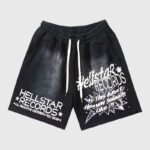 Front view of black Hellstar Heaven Sounds shorts with graphic screen prints, featuring an elastic drawstring waistband.