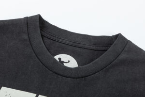 Close-up view of the ribbed neckline on a premium black Hellstar Heroes Villains t-shirt featuring graphic detail.