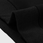 Close-up view of the ribbed fabric and high-quality cuff detail on the black Hellstar Howlin Unisex Fleece Hoodie.