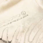 Close-up view of the cream Hellstar HStar Records hoodie featuring a detailed vintage-style graphic print.