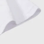 Close-up view of the white cotton fabric sleeve detail on the Hellstar HStar Retro T-Shirt with premium stitching.