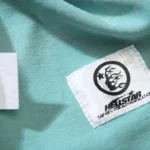 Close-up of the Hellstar Human Skeleton T-Shirt label featuring an authentic NFC tag for brand verification.