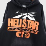 Hellstar black hoodie with orange If You Dont Like Us Beat Us graphic print and vintage streetwear aesthetic style