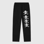 Black Hellstar sweatpants featuring white graphic skull prints from the If You Don’t Like Us Beat Us streetwear collection.