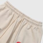 Hellstar If You Don’t Like Us Beat Us sweatpant in beige with an adjustable drawstring elastic waistband and fleece fabric.