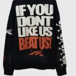 Black Hellstar If You Don't Like Us Beat Us tracksuit hoodie with bold white and orange graphic slogan and skull sleeves