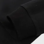Close-up view of the ribbed sleeve cuff on the black Hellstar Inner Peace Fire Hoodie premium cotton sweatshirt.
