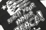 Close up of the Hellstar Studios Inner Peace T-shirt graphic featuring white text and design on a black cotton background.