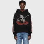 Front view of a black Hellstar Jason mask graphic hoodie featuring a vintage washed fleece fabric design on a model.
