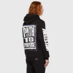 Back view of a person wearing a black Hellstar Jesus Freak hoodie with Path to Paradise graphic print on the back