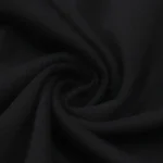 Close-up view of the premium black cotton fabric used for the Hellstar Jesus Freak T-Shirt showing texture and quality.