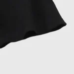 Close-up view of the premium black cotton fabric on the Hellstar Jesus Freak T-Shirt showing high-quality texture.