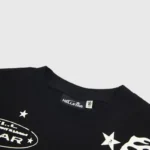 Close-up view of the interior neck tag on a black Hellstar Jesus sweatshirt featuring brand logo and size label.